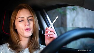 Meet Anastasia In Her Car While She Is Smoking Two 120mm All White Cigarettes