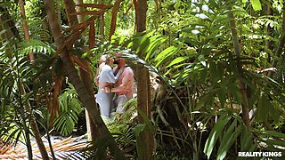 busty babe fucks a muscular stud in the jungle