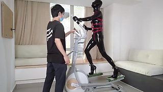 Mz27 - a Girl Bound in Latex Walks on a Treadmill